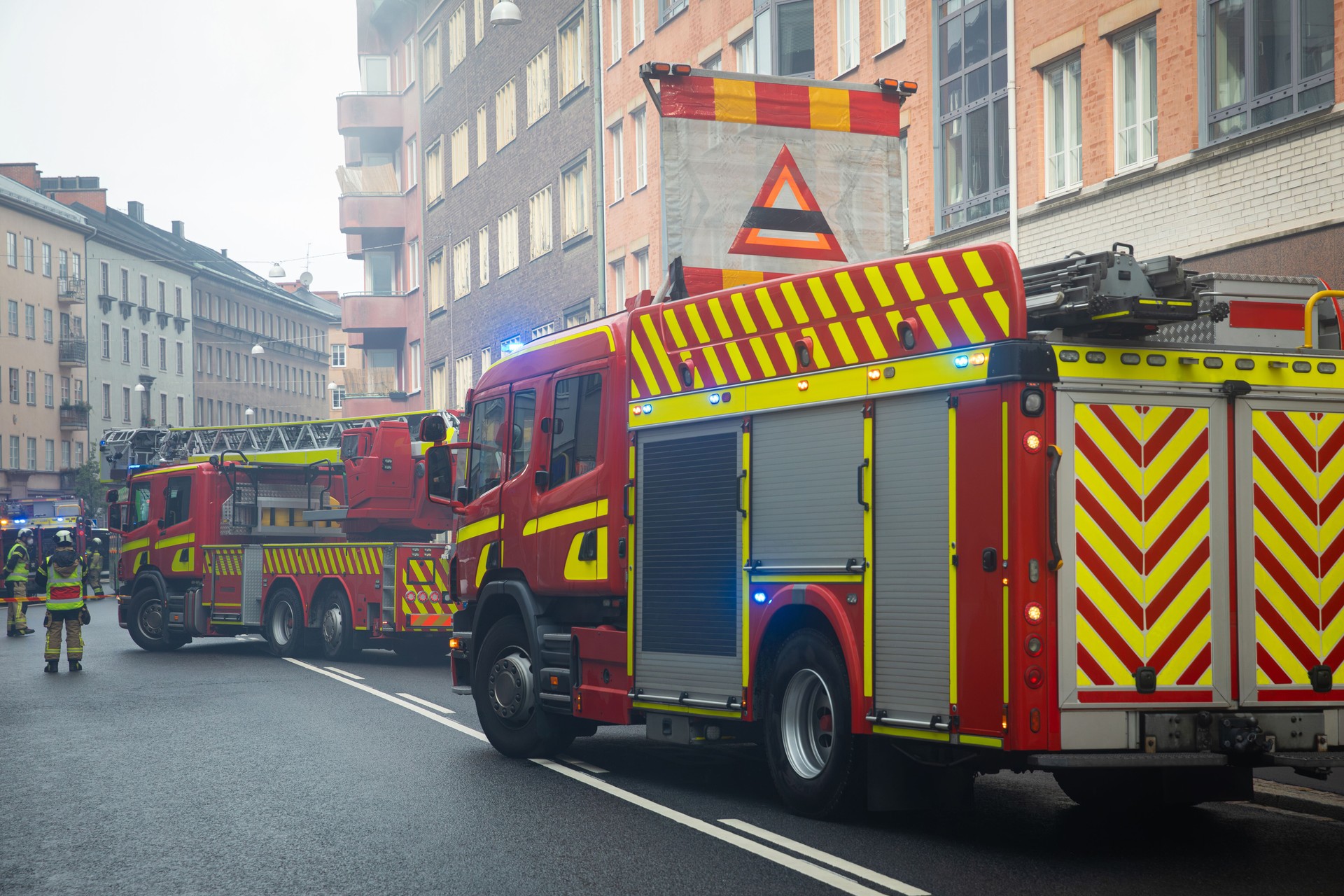 Fire emergency - Firefighters and fire truck on the road